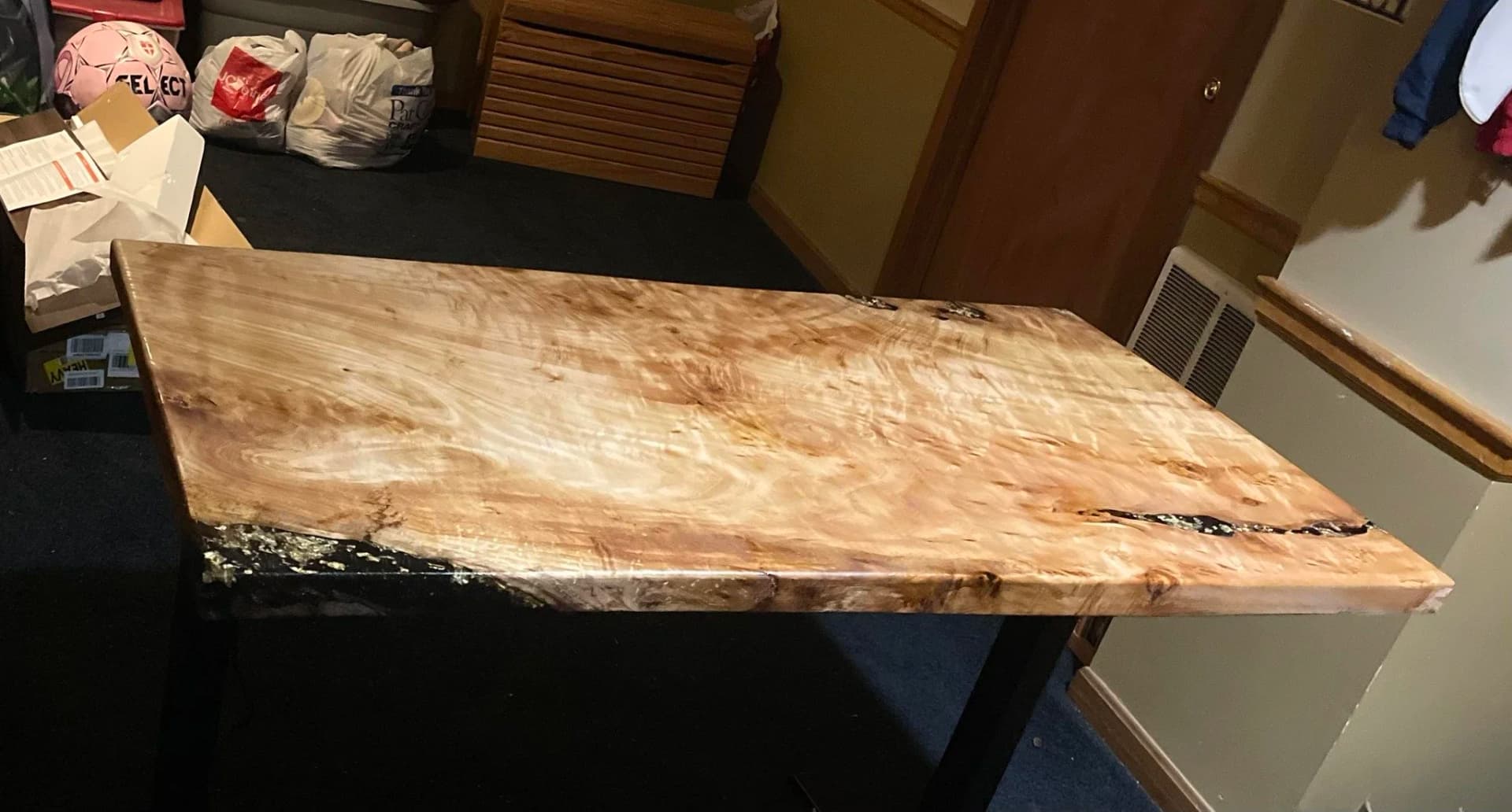 A single live-edge spalted maple slab, finished entirely by hand