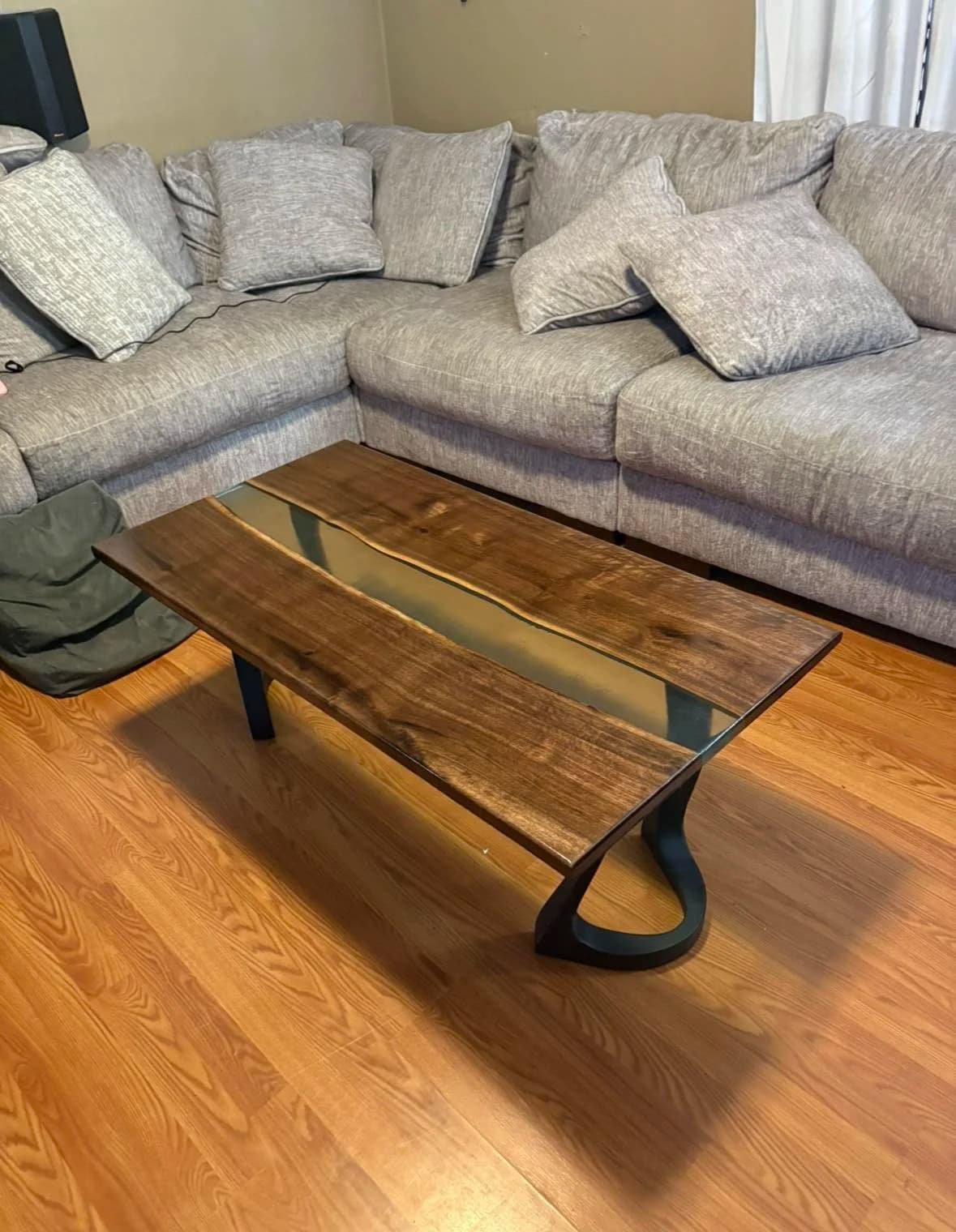 The River Table, a bespoke commission in Bookmatched walnut · cast resin · sculpted base